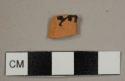 Lead-glazed red earthenware sherd with outer black glaze and clear inner glaze