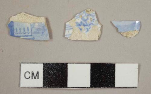 Blue transfer whiteware sherds, with architectural and floral designs