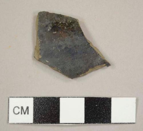 Lead glazed red earthenware sherd with black glazed exterior