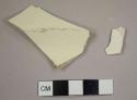 Creamware sherds, including one marley fragment from a possible soup bowl