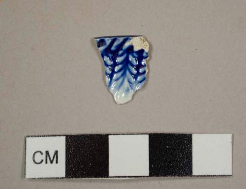 Pearlware rim sherd to a plate or charger with a blue decoration and molded rope pattern