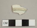Pearlware plate base sherd with tall footring