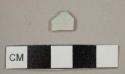 White salt-glazed stoneware sherd with traces of blue decoration near one edge