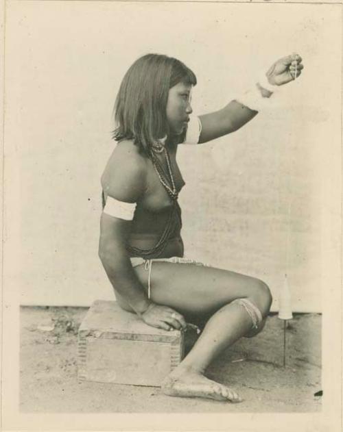 Girl spinning cotton