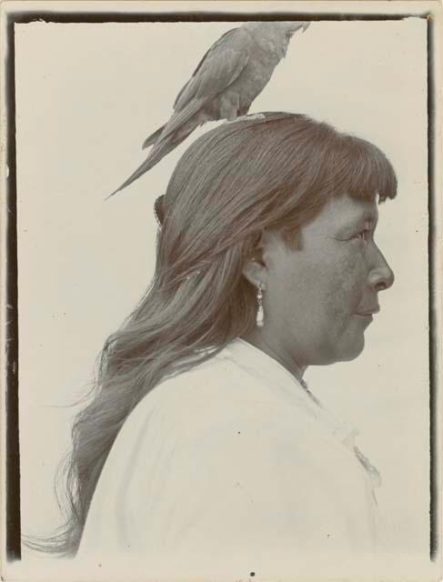 Janet, with bird perched on her head