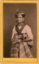 Woman standing with hat, jewelry