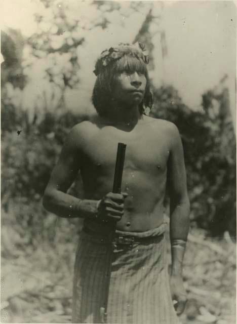 Man holding long barelled shot gun