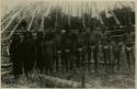 Group of young men and women in front of house frame