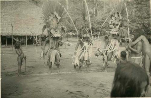 Men dancing in ceremonial costume