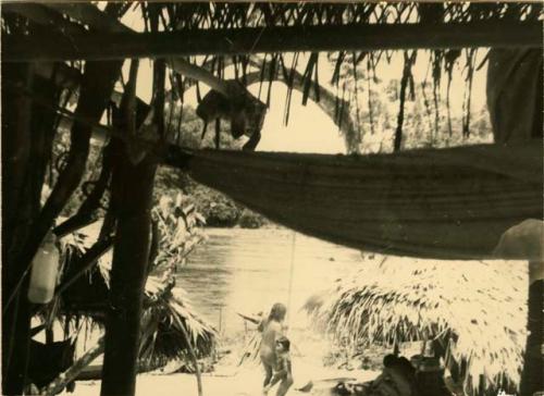 Village scene, hammock in foreground