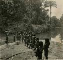 People gathered on river bank