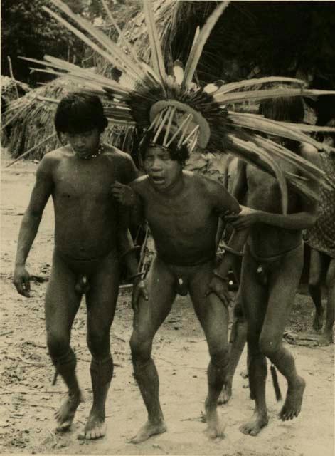 Tapirape Shaman wearing ceremonial headdress during the thunder ceremony