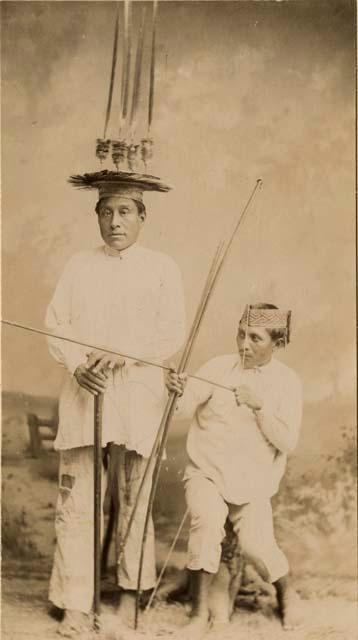 Man with headdress and man with bow and arrow