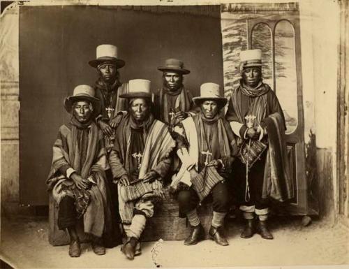 Studio portrait of six men sitting