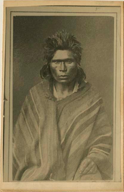 Studio portrait of man sitting