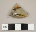 Black lead-glazed, red earthenware sherd