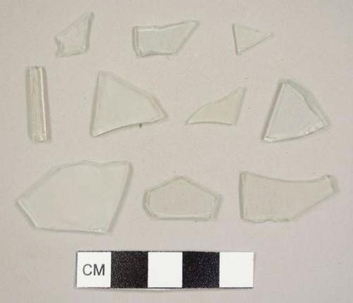 Colorless flat glass fragments, one possibly curved