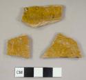 Refined buff-paste earthenware sherds with lead glazed interior and unglazed exterior, possibly from the same vessel