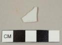 Undecorated porcelain plate rim sherd