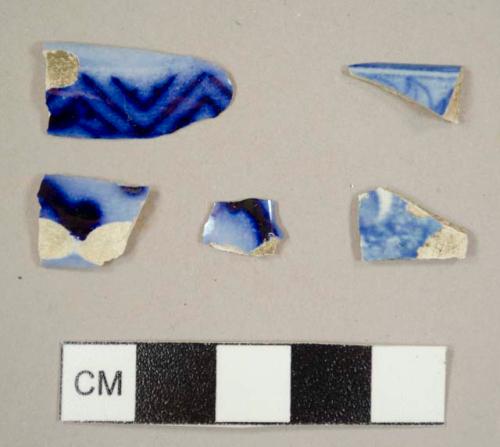 Blue-on-white transferprinted refined earthenware sherds, including three possible flow-blue sherds and one rim sherd to a bowl