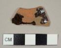 Black, lead-glazed red earthenware sherd, possibly Buckley type