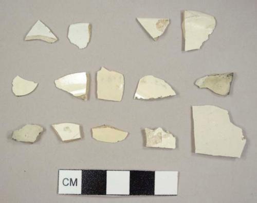 Twelve creamware sherds, including two plate rim sherds, and two pearlware sherds, including one plate rim sherd