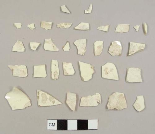 Creamware sherds, including one sherd with feather-edged molding