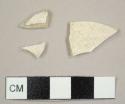 Unglazed earthenware sherds, including one kaolin pipe bowl fragment