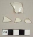 White salt-glazed stoneware sherds, including on rim to a cup with a 14cm diameter