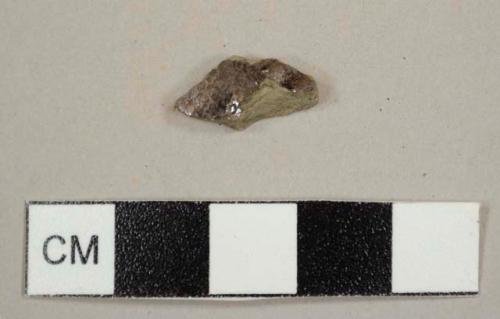 Grey earthenware sherd with lustrious glazed exterior and yellow lead glazed interior