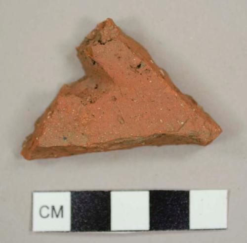 Handmade brick roof tile sherd with partial nail hole