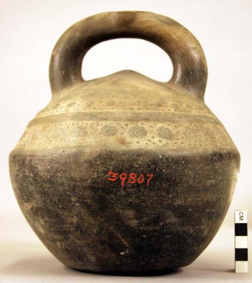 Pottery jar mouth in center of cross handle, stamped