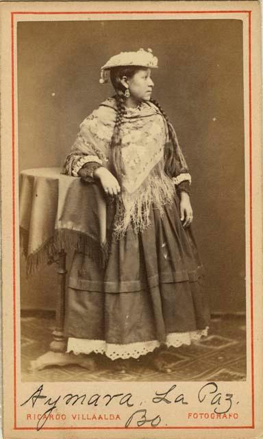 Studio portrait of woman standing