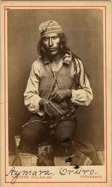 Studio portrait of man sitting