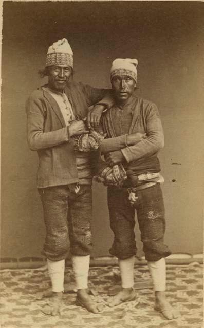 Studio portrait of two men standing