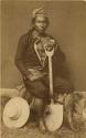 Studio portrait of man with shovel