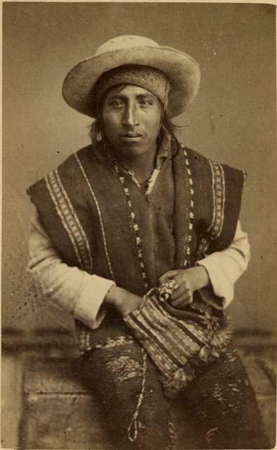 Studio portrait of man sitting