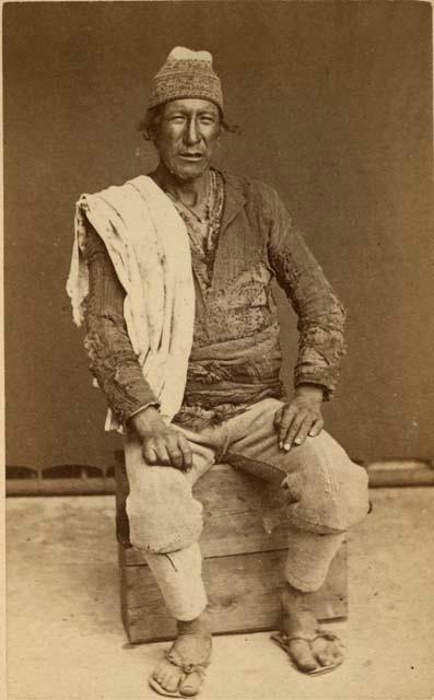 Studio portrait of man sitting