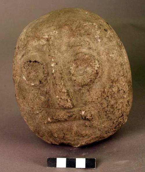 Carved stone, human head