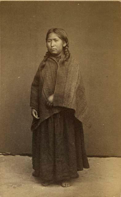 Studio portrait of woman standing