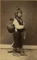 Studio portrait of boy with ceramic vessel