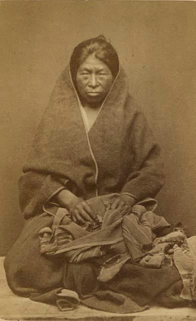 Studio portrait of woman sitting