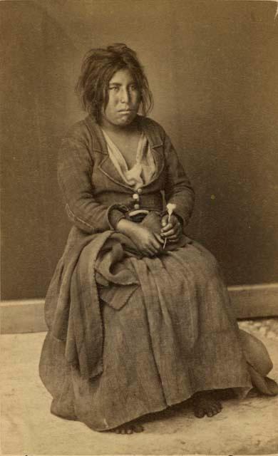 Studio portrait of woman sitting