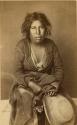 Studio portrait of woman sitting