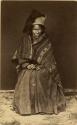 Studio portrait of woman sitting