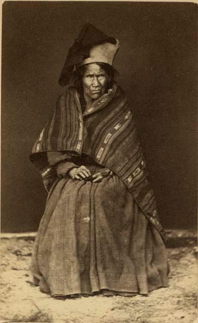 Studio portrait of woman sitting