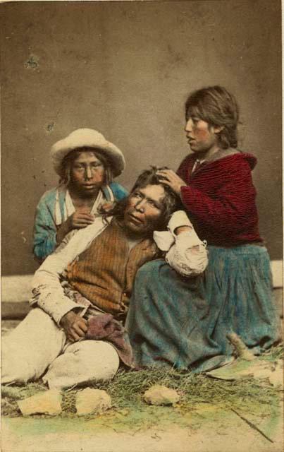 Studio portrait of two men and a woman