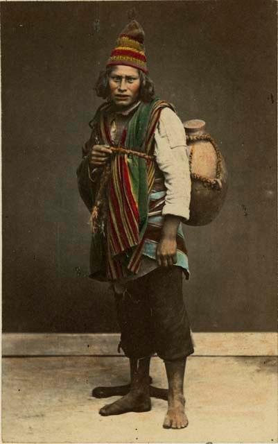 Studio portrait of man carrying a ceramic vessel