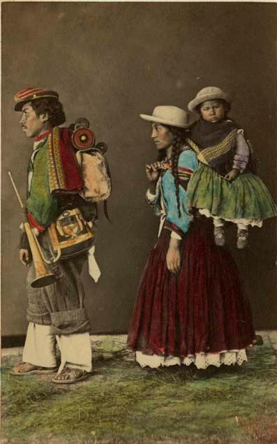 Studio portrait of man, and woman carrying child