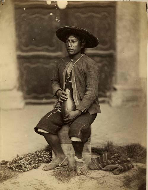 Studio portrait of man sitting